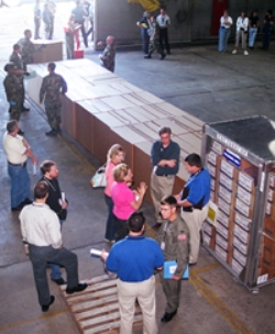 Image of boxes being moved in a warehouse during an exercise.