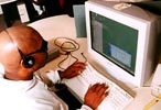Photo: Man Using Computer