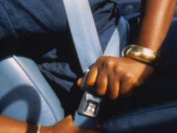 Image: Photo of man fastening seatbelt.