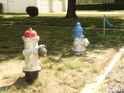 New hydrant (red top) installed and oldhydrant (blue top) to be replaced.