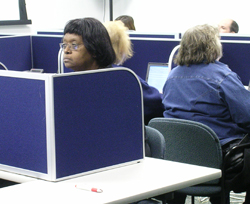 Image of a volunteer being trained in the Public Health Call Center.