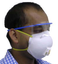 Image of a volunteer demonstrating how to wear a mask for protection
during an emergency.